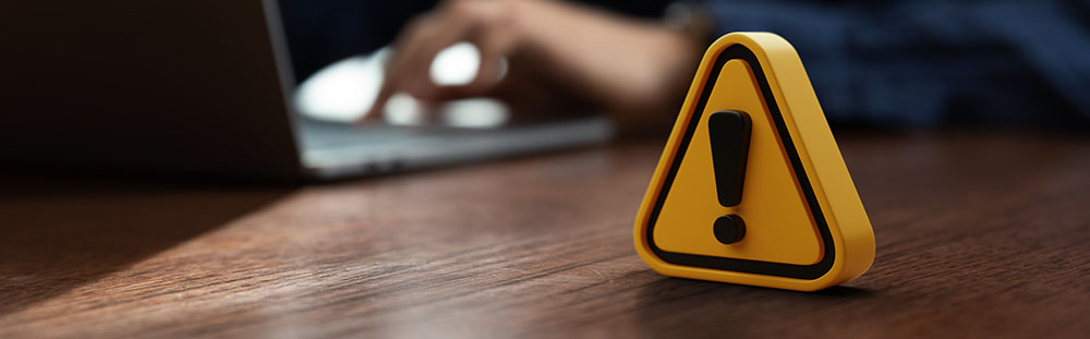 Warning sign on table in front of businessman Caution in investing Economic situation warning, Deflation and inflation concept money saving for retired and office syndrome also.